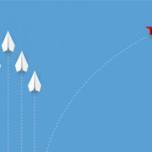 paper airplanes against blue background; red plane flies off in a different direction
