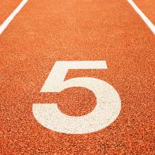 numeral 5 on a running track lane