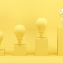 Four lightbulbs on pedestals