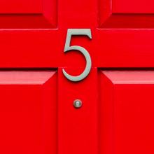 house number 5 on a red door