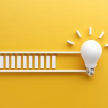 loading bar ending with lightbulb against yellow background