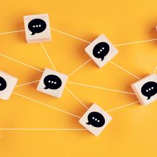 web of blocks with speech bubbles against yellow background