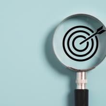 magnifying glass over target