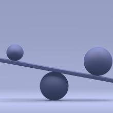 Image of two balls balancing on a board