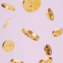 Coins floating against a pink background