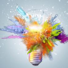 Image of a light bulb exploding with colors