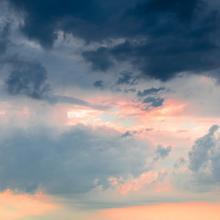photo of storm clouds against orange sky