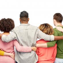 group of multiracial and multigenerational people standing together